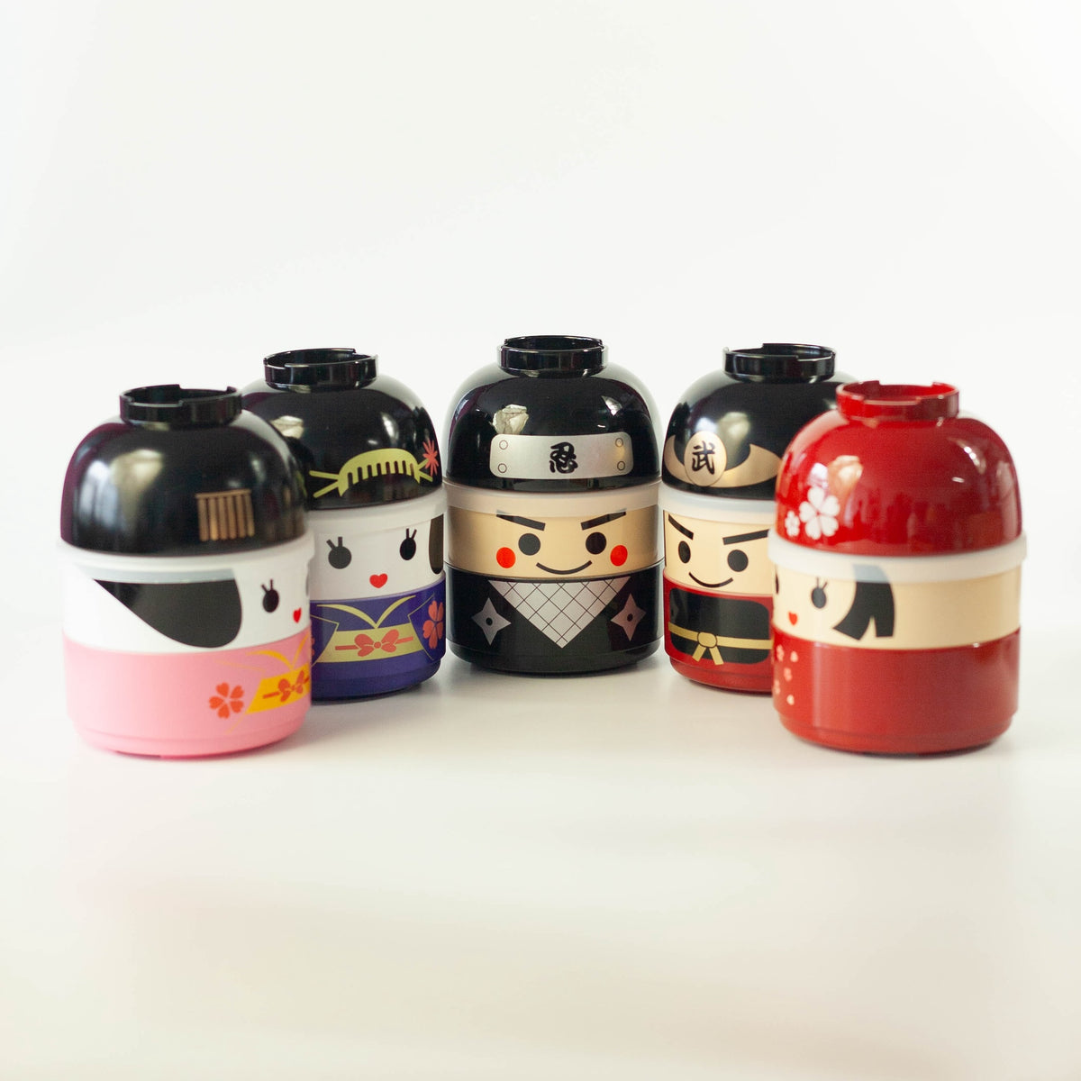 Kokeshi Bento Box collection showing five character designs including Hanako, ninja, samurai, and geisha