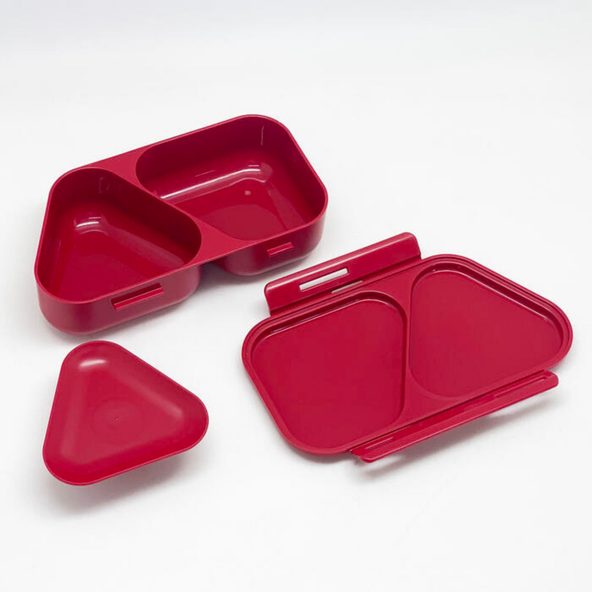 Onigiri Maker Bento Box Moon Rabbit closed, deep red with moon, cherry blossom and white rabbit design on lid, angled view on wooden surface