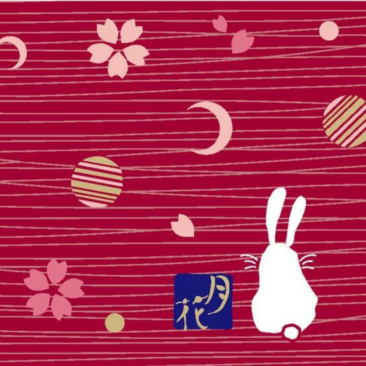Onigiri Maker Bento Box Moon Rabbit closed, deep red with moon, cherry blossom and white rabbit design on lid, angled view on wooden surface
