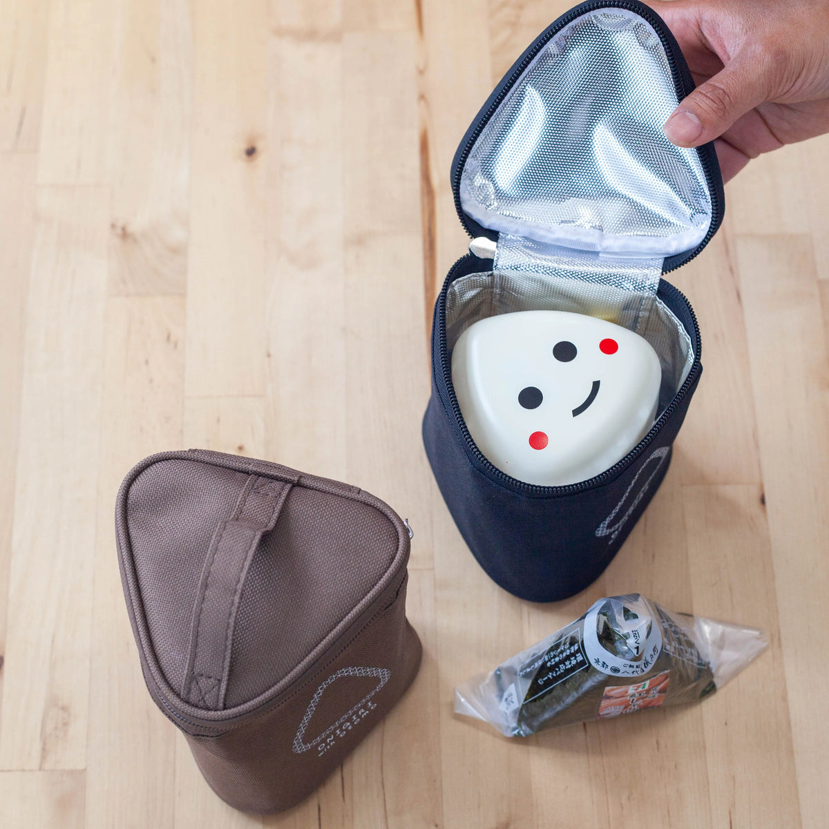 Otomo insulated onigiri lunch bags in brown and black with side dish containers