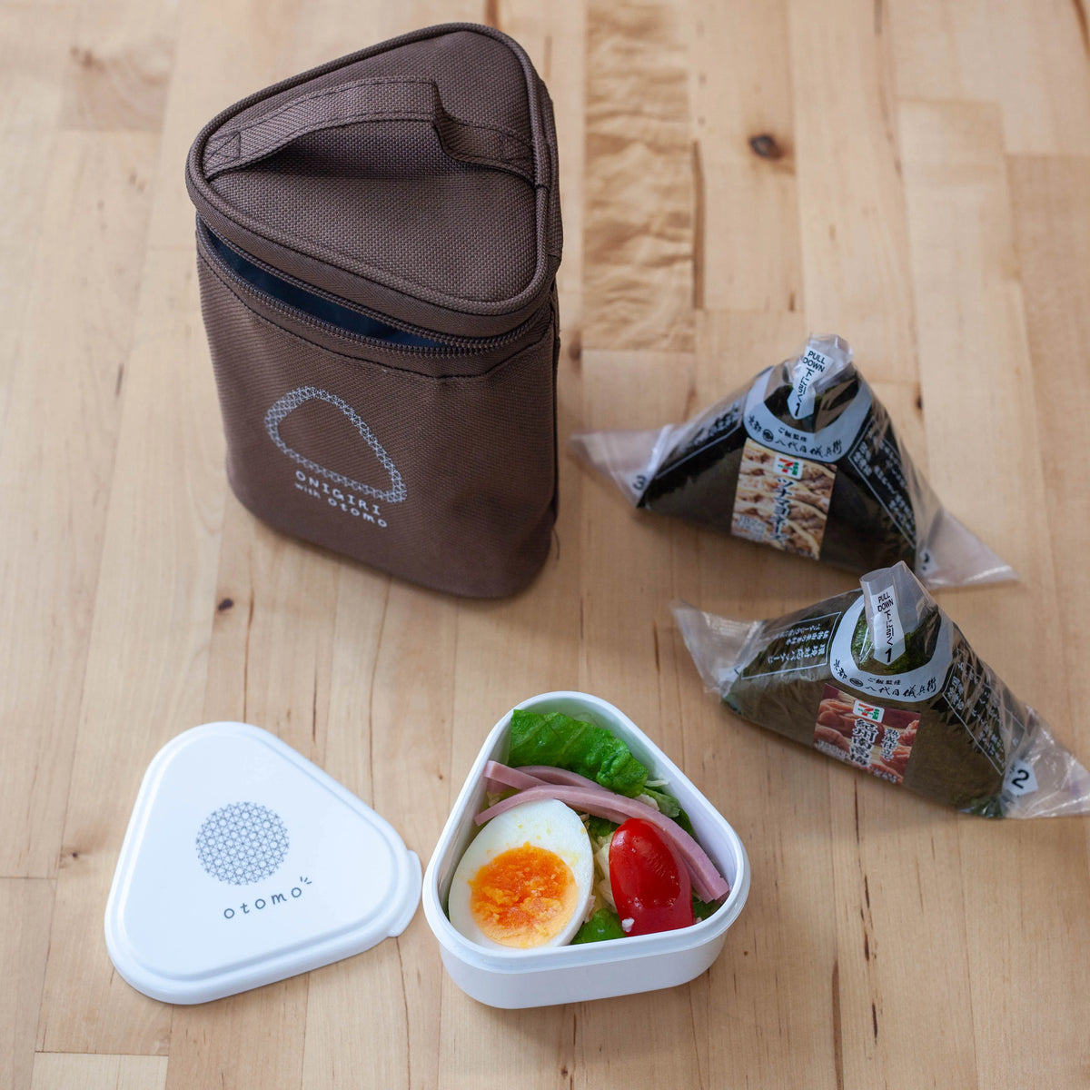 Otomo insulated onigiri lunch bags in brown and black with side dish containers