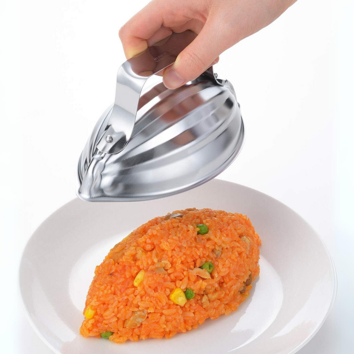 Hand lifting Restaurant Style Rice Mold revealing perfectly shaped oval chicken rice on white plate, in-use demonstration