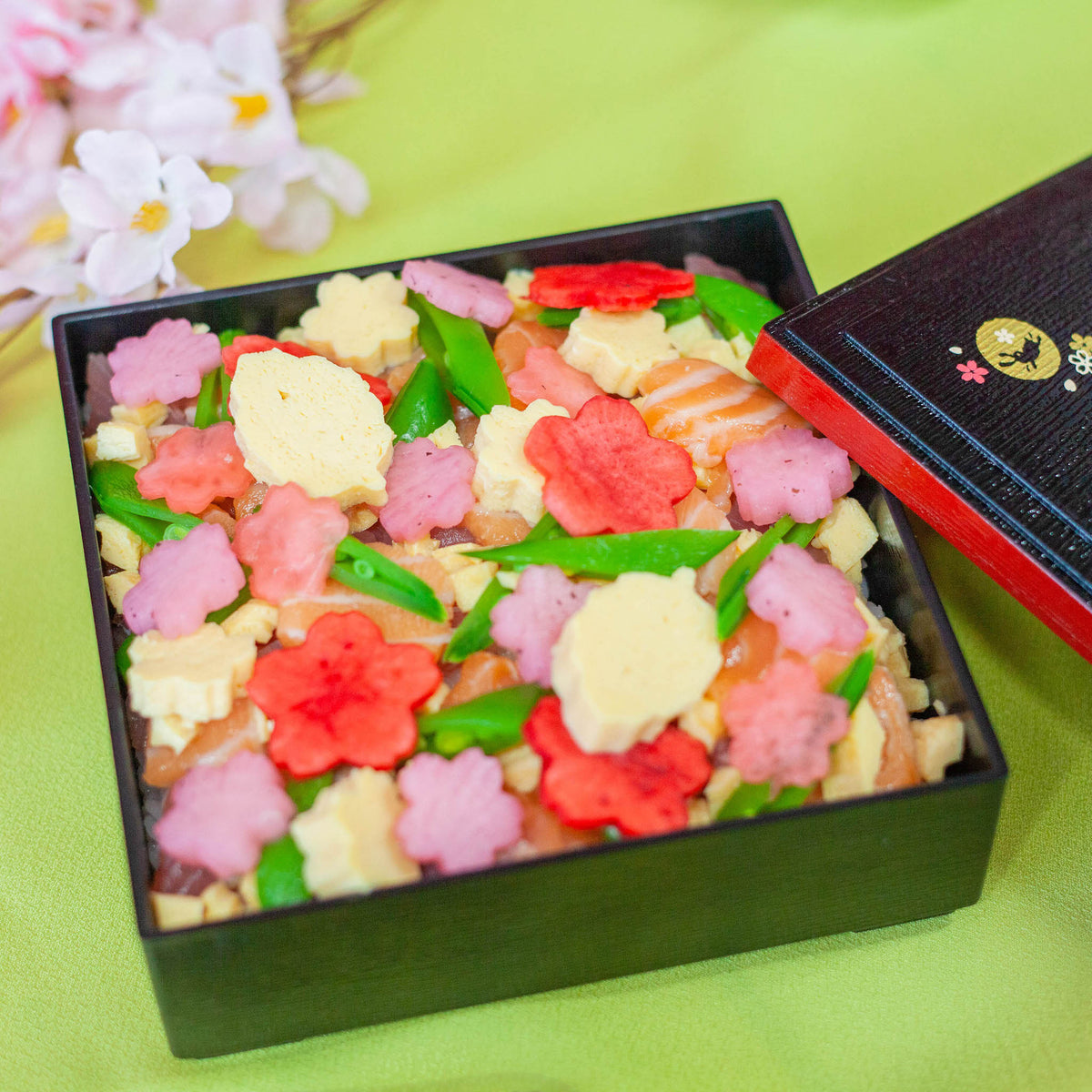 Bento box with colorful sakura-shaped vegetable garnishes made using the Sakura Cutter Set

