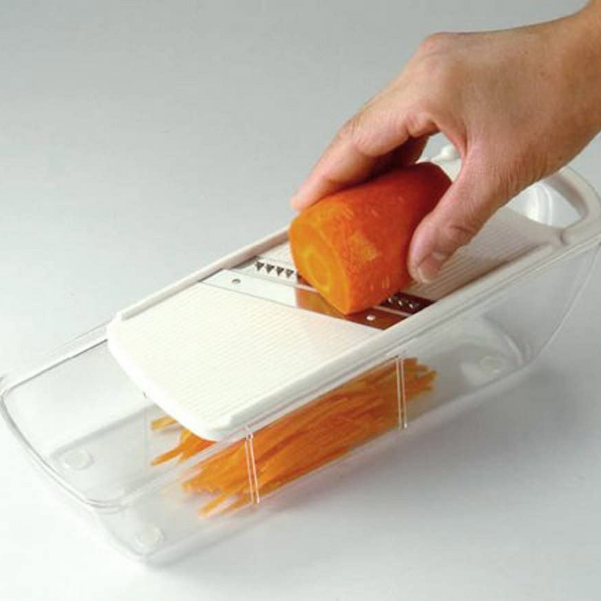 Mandoline Slicer Set with 4 interchangeable blades, peeler, and storage tray