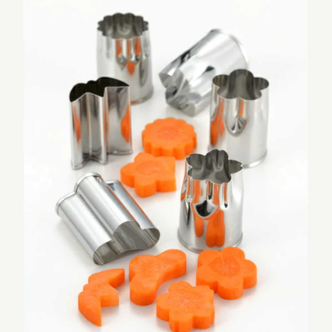A collection of Japanese food cutters made of stainless steel, displayed alongside cut carrot shapes illustrating the cutter's function.