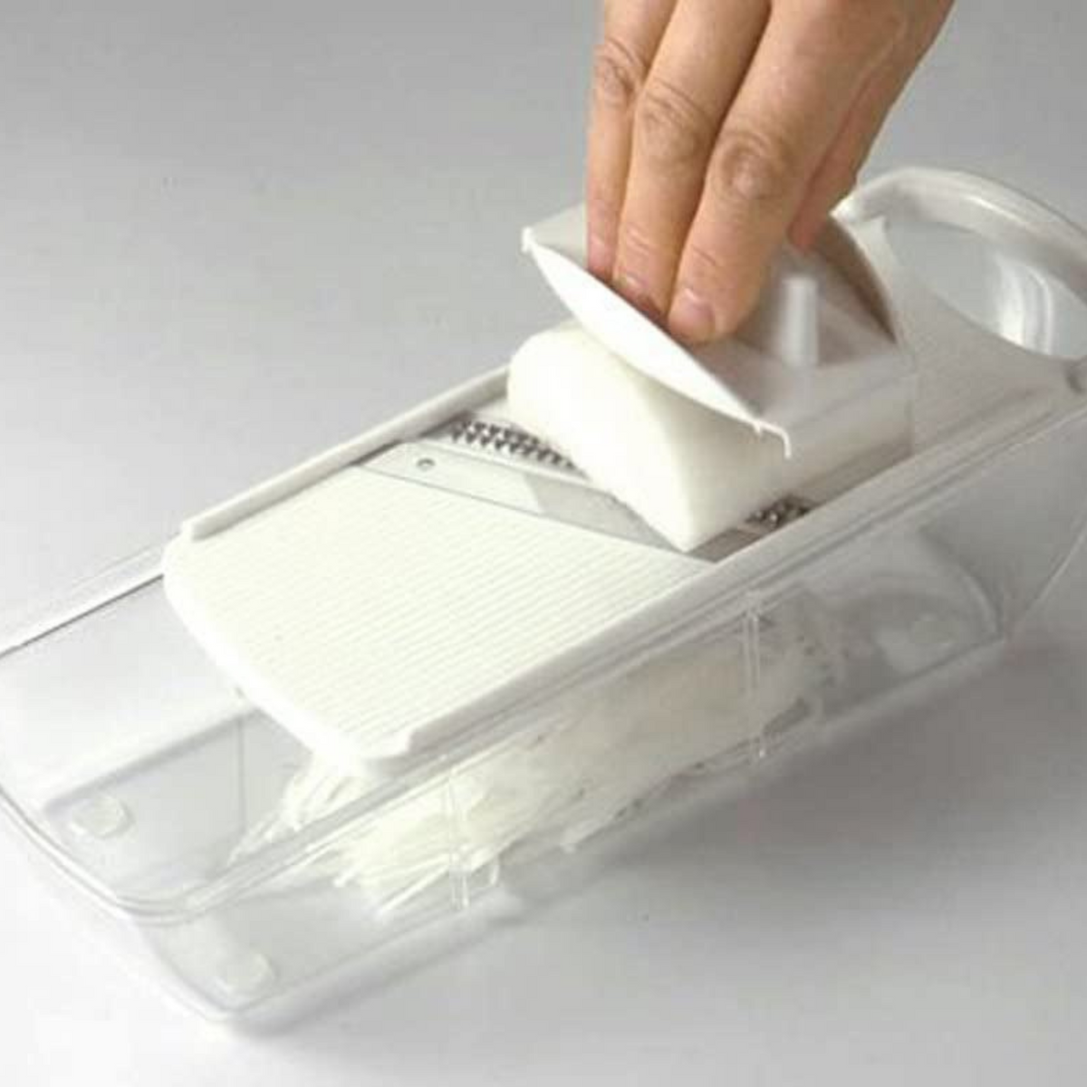 Mandoline Slicer Set with 4 interchangeable blades, peeler, and storage tray