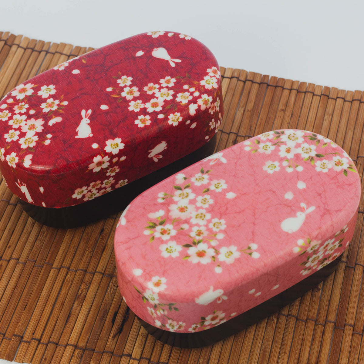 Sakura Usagi Bento Box 830mL in red and pink, featuring cherry blossom and rabbit pattern, top view