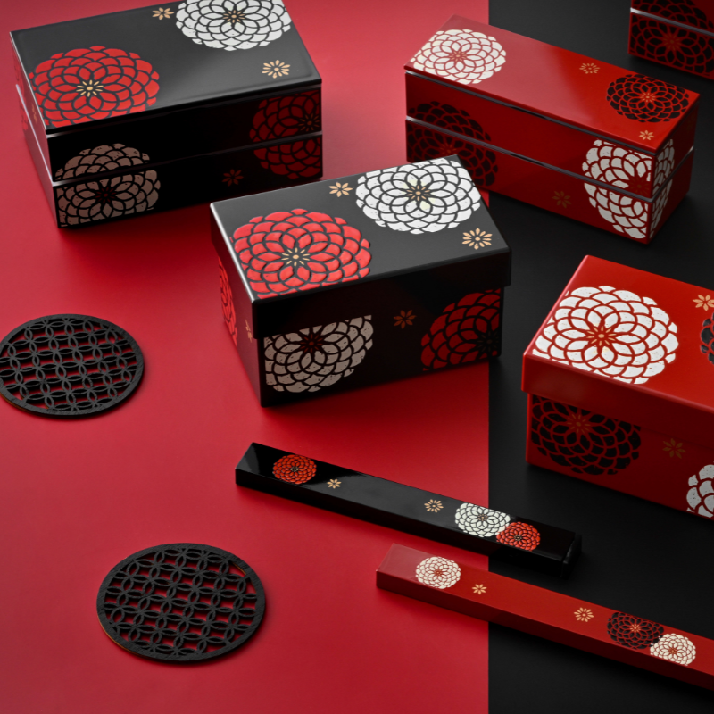 Ojyu Chopsticks Set with wooden chopsticks and slide-style case, available in red and black